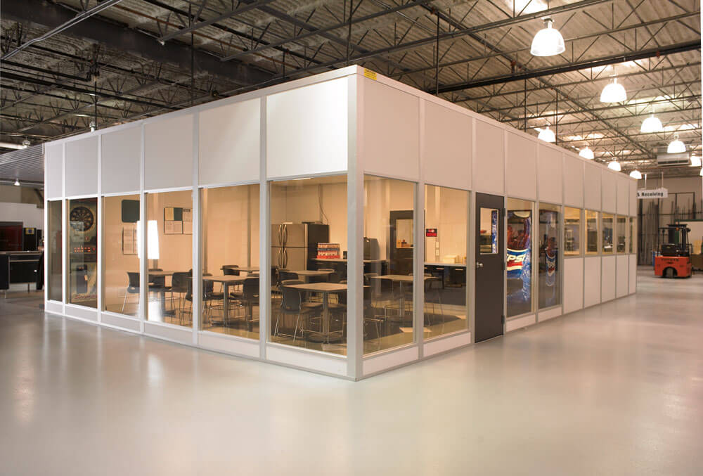Completed in-plant office enclosed with modular walls inside warehouse
